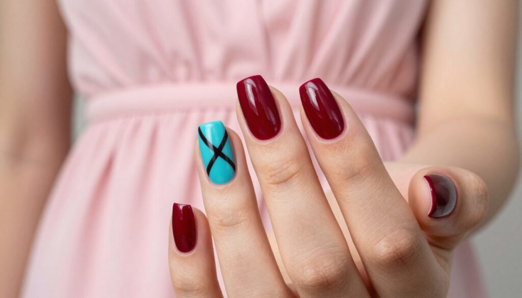 A close-up image showcasing bold contrast nail designs on a well-manicured hand. The foreground features a hand with elegantly shaped nails painted in a striking combination of deep cherry red and bright turquoise accents. The nails should be adorned with abstract geometric patterns that symbolize daring contrasts, reflecting a modern and edgy style. The middle ground includes a soft-focus background of a delicate, powder pink dress draping elegantly, creating harmony with the nail colors. The lighting is bright and vibrant, capturing the glossy finish of the nail polish while creating a refined atmosphere. The image conveys a stylish and confident mood, appealing to lovers of bold fashion choices.